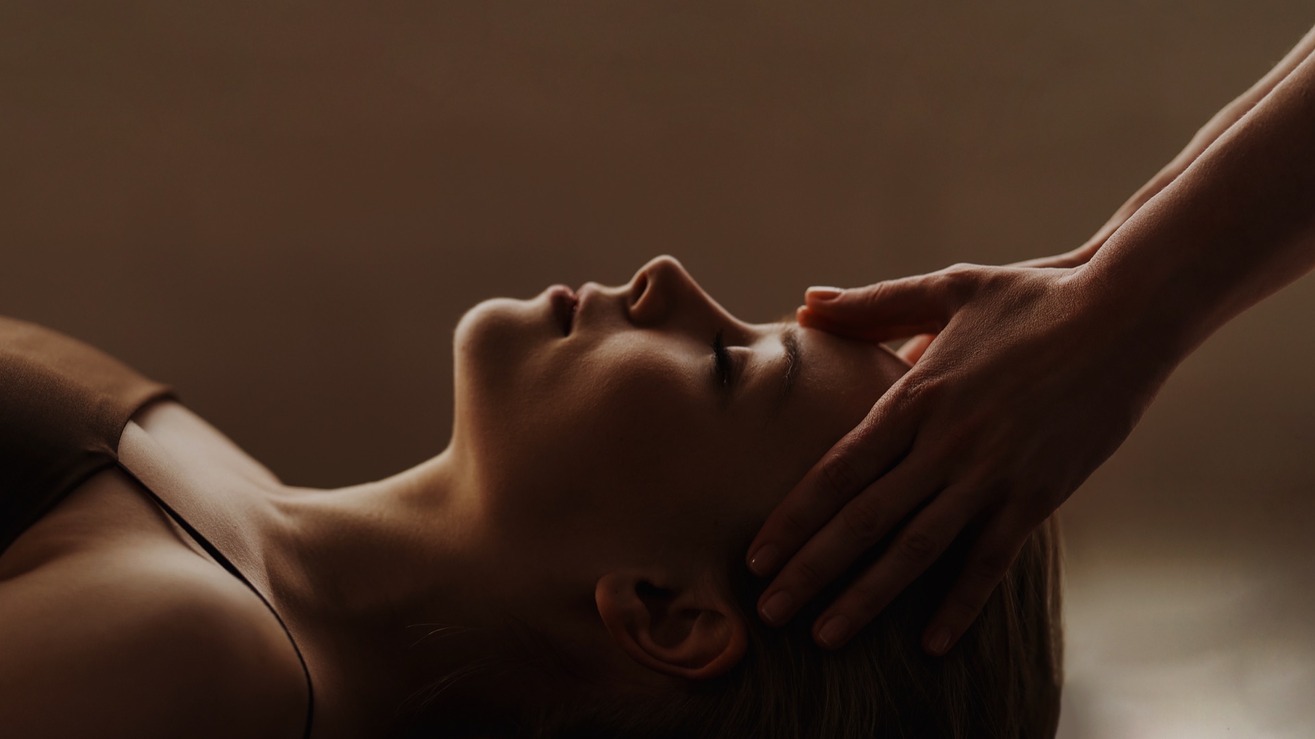 Therapist providing a calming head and neck massage
